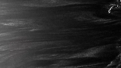 Verstreutes Mehl auf schwarzem Hintergrund. Schwarze Hintergrundtextur © piotrszczepanek
