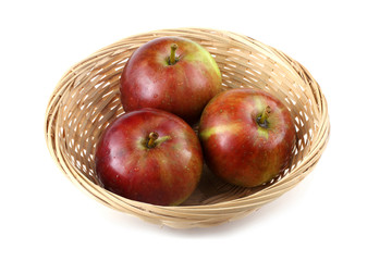 Apples on wicker plate