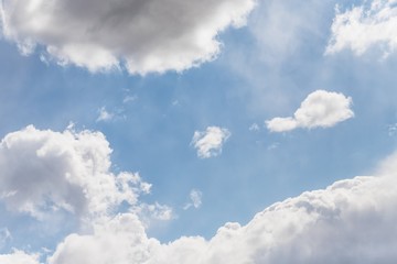 Light blue soft sky with beautiful white clouds