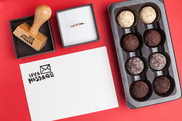 love message card with diamond ring and candies