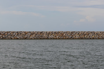 Large stones Was prepared in place of the sandy beach for the wave walls