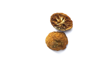 Rotten bergamot, It has brown color and dry peel that isolated on a white background.