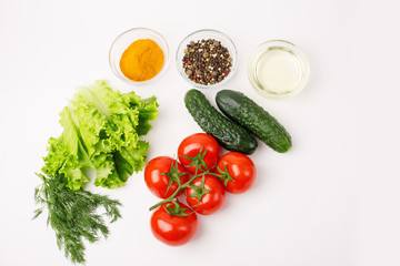 tomatoes and cucumbers and spices isolated on a white background, cooking concept. Food background.