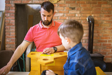 Father and Son Making a Birdhouse