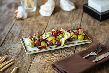 Wine appetizers olives artichokes and tomatoes