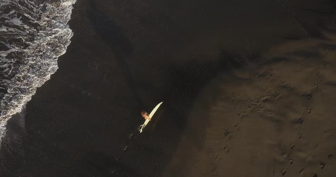 Aerial view of surfer at the beach, Kedungu, Bali, Indonesia