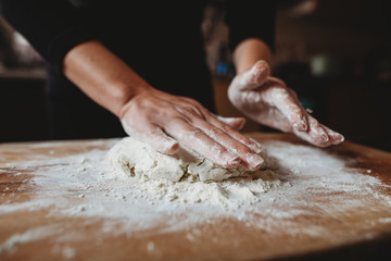 Hands preparing and kneading gnocchi 