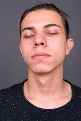 Obraz premium Face of young handsome man with eyes closed