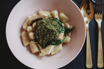 Bowl of handmade gnocchi and basil pesto 