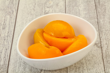 Marinated peaches fruit in the bowl