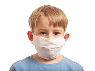 Portrait of a sad boy in a mask. concept of behavior in the COVID-19 coronavirus pandemic.