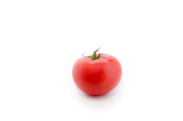 a red tomato lies on a white isolated background