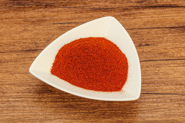 Dry paprika powder in the bowl