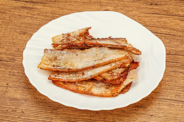 Roasted juicy bacon in the plate