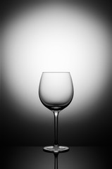 empty wine glass on the lumen with reflection