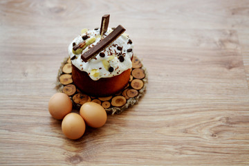 Easter holiday, eggs baking on a wooden background wrapped in a brown ribbon. Place for text