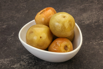 Pickled green tomato in the bowl