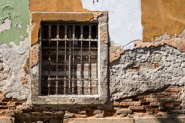 Window with grating of an abandoned house