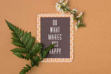 Motivational quote with spring flowers