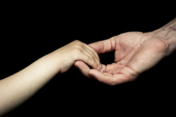 Fototapeta premium old man's and child hand