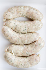 Raw Chicken meat Sausages on white background