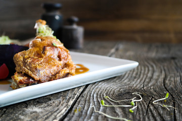 Roast duck leg with purple cabbage, detail