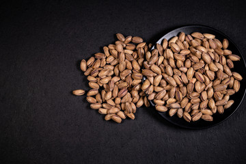pistachios on the plate, Superfood, vegan, vegetarian food concept, Healthy snack.