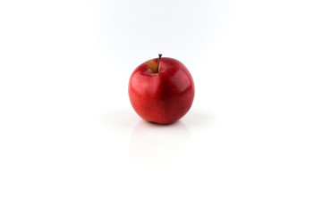 red apple with reflection on white background