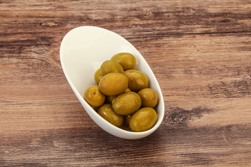 Green pickled olives in the bowl