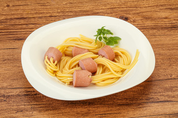 Kids pasta spaghetti with sausages