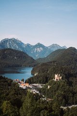 Germany. View of the yellow castle on a background of green forests and lakes