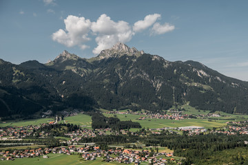 Fototapeta na wymiar Germany. View of the alps and alpine village. Mountains, houses, sunny weather.