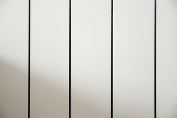 Close-up of a white electric radiator for winter heating and energy saving