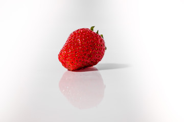 Organic strawberry on a white background. 