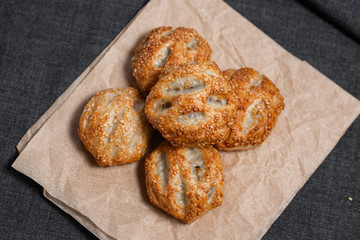Buns from the furnace craft, food paper
Photo on a dark background