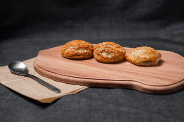 Food on a wooden board.
Baking, rolls, bread, bakery food. Milk in a glass.
Kraft, food paper