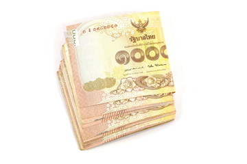Many 1000 baht banknotes on a white background