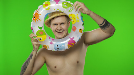 Shirtless young man tourist looking out of the swimming. Chroma key