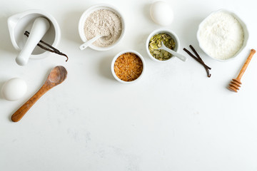 Homemade culinary - baking of fresh bread or cookies from natural organic ingredients on a light grey background.