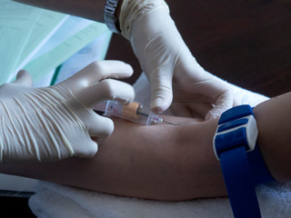 covid-19.  nurse will take a blood sample from a vein for coronavirus testing.