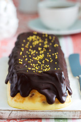 Lviv cheesecake, a traditional Ukrainian dessert with raisins, coated with chocolate icing.
