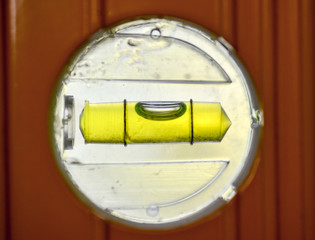 Spirit level ,used for DIY,brightly backlit with it's bubble almost centered.