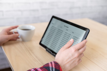 Online exam. Woman student testing exercise. Examination test on the tablet for school, university. multiple choice answer sheet. Home school, online study. Tutorial