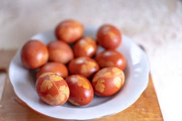 Colored eggs with an ornament for Easter