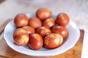 Colored eggs with an ornament for Easter