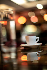 Cup of coffee espresso with glass of water bokeh sunlight sunshine daylight cafe house