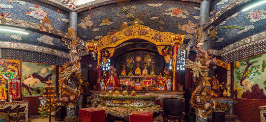 Inside the main hall of Phu Chau temple is elaborately decorated with many fragments of crockery, with a age of 3 centuries and is widely sought after by the sacred.