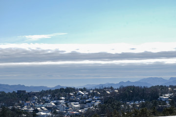 Aerial view Scenic Landscape town village at Kusatsu Onsen with sunlight blue sky and clouds background in Japan