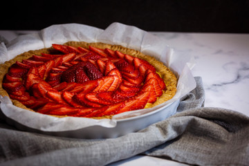 Close-up Delicious traditional homemade strawberry pie Crostata di fragole, on dark background.
