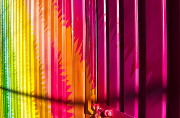 Colorful pink abstract design on metal container